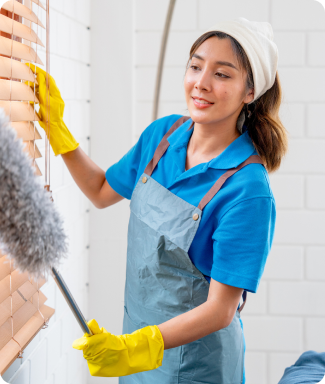 a hospitality worker cleaning a space